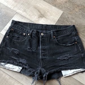 Worn in black levis shorts